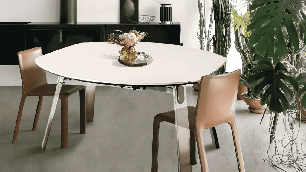 A compact dining setup featuring a white table and two chairs identified as a small extendable dining table A compact dining setup featuring a white table and two chairs identified as a small extendable dining table