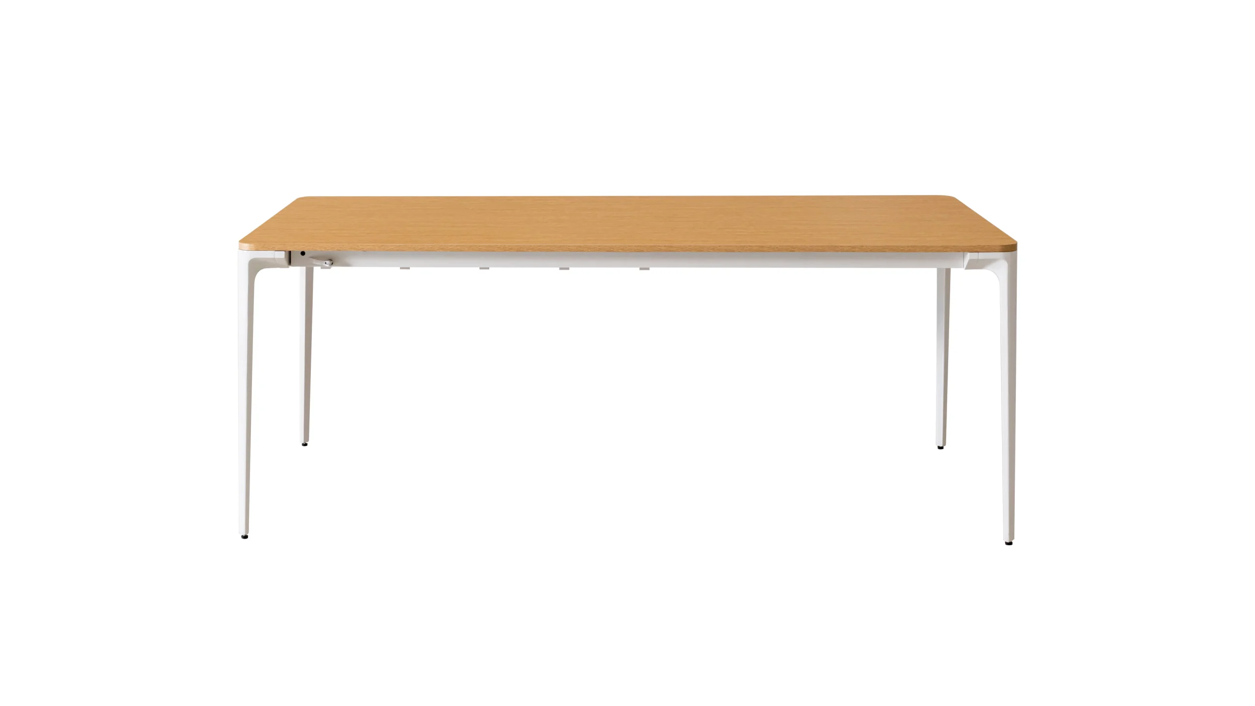 Extendable outdoor dining table with a wooden top and white frame collapsed configuration on the gray floor