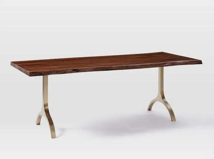 Sleek trestle dining table with a rich wooden top and elegant curved metal legs