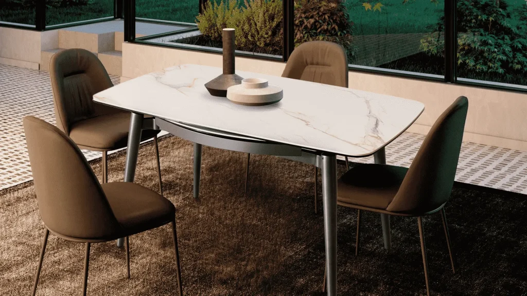White extendable dining table with marble top set in a bright room with large windows and modern chairs White extendable dining table with marble top set in a bright room with large windows and modern chairs