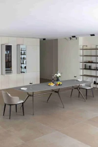 Modern dining table with winter décor featuring wine fruits and flowers