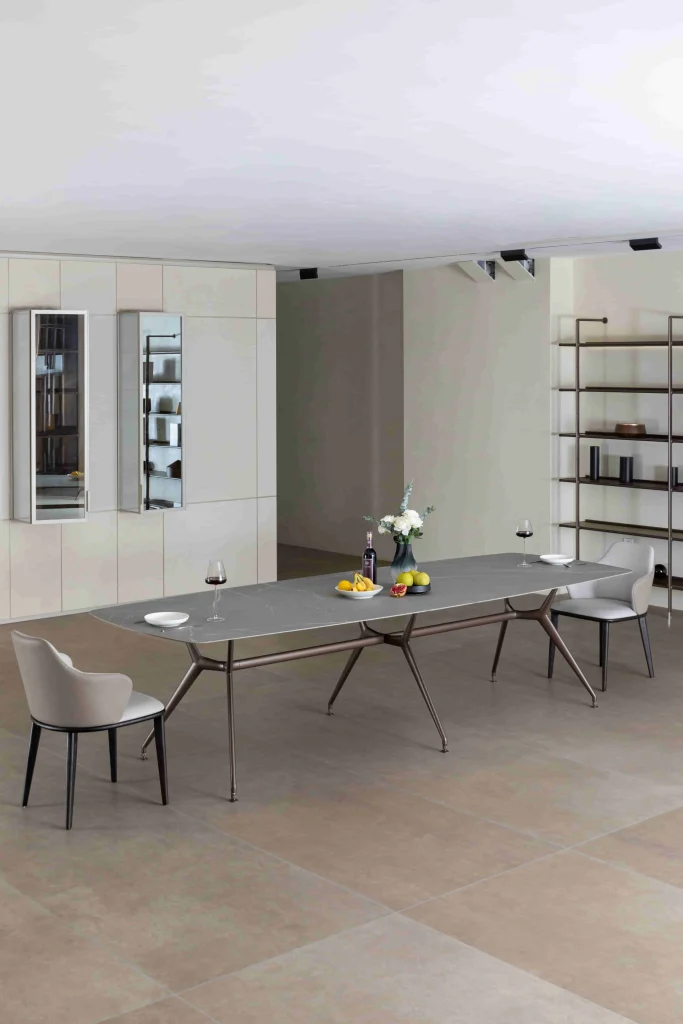 Modern dining table with winter décor featuring wine fruits and flowers