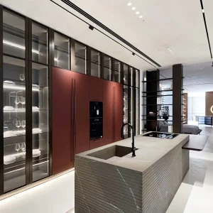 Sleek modern modular kitchen with glass cabinets and island sink