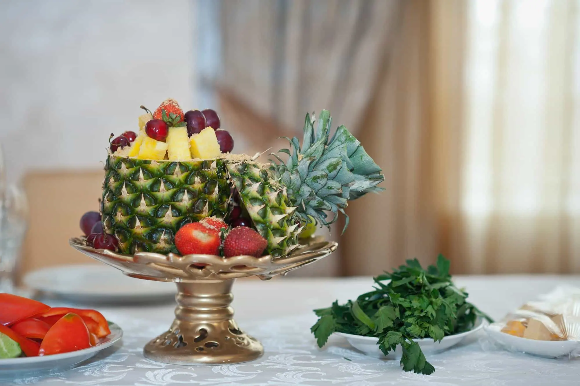 Summer table decorated with bowl of harvested vegetables Summer table decorated with bowl of harvested vegetables