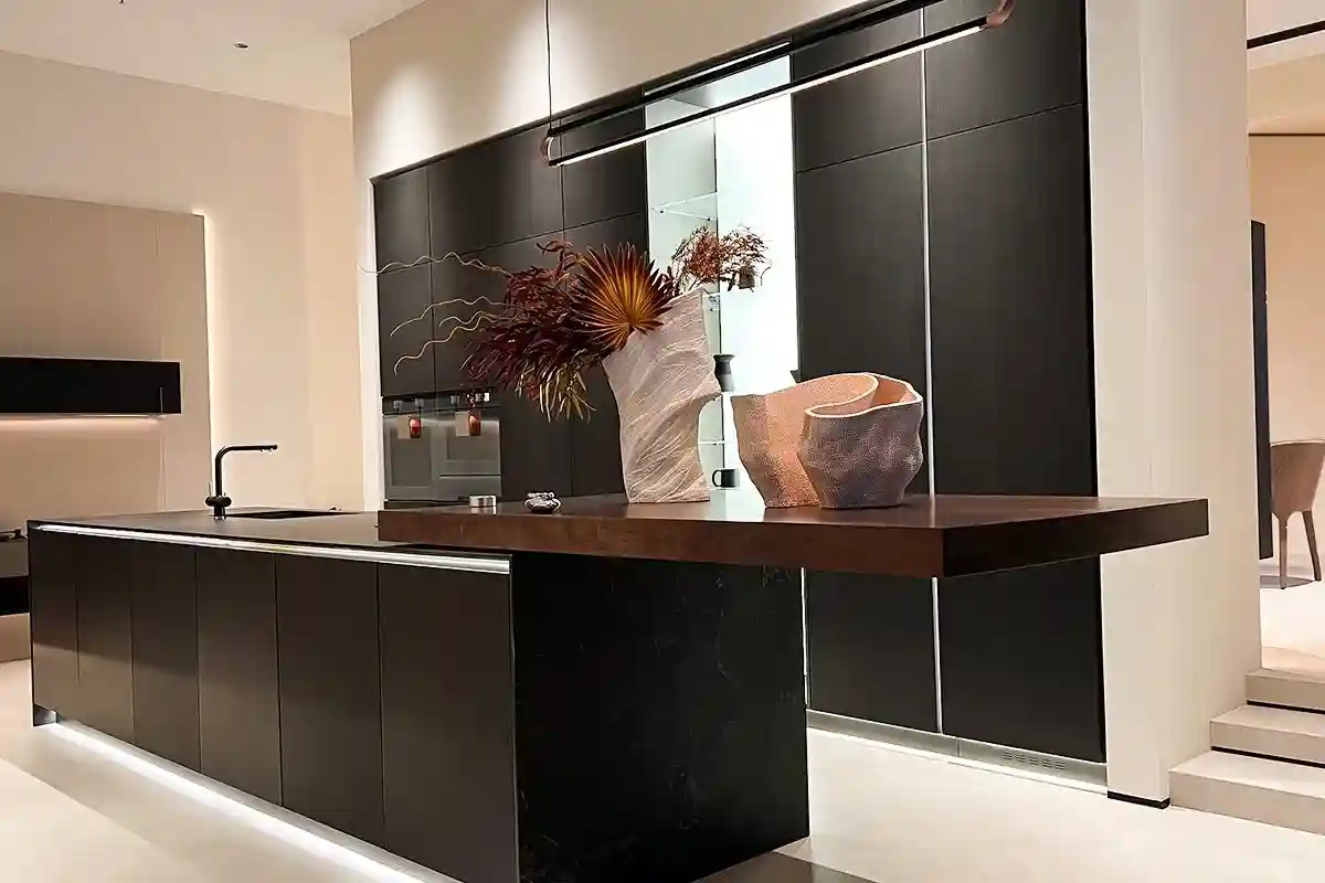 13Designer kitchen with dark cabinets and unique lighting fixtures