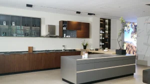 Contemporary kitchen with dark wood and glass cabinetry