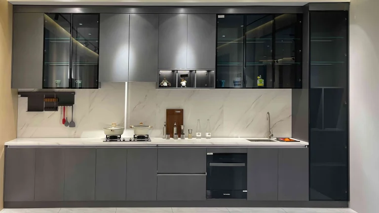 Modern kitchen with gray cabinets and sleek appliances