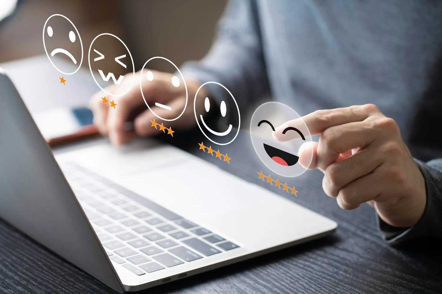 Person using a laptop with a finger selecting a happy face icon symbolizing positive Customer Feedback and satisfaction