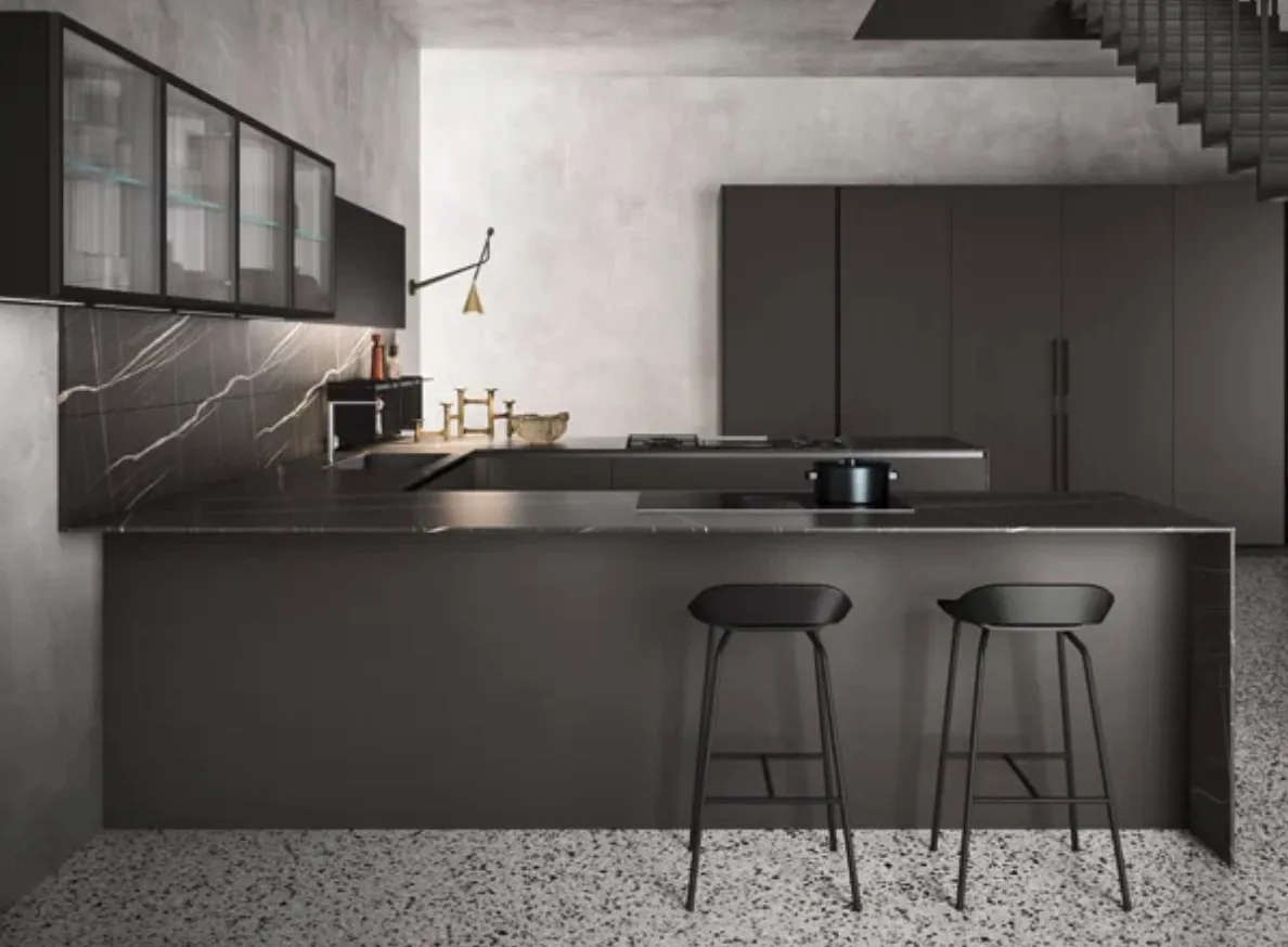 The kitchen cabinets are a matte black contributing to a sophisticated and contemporary look