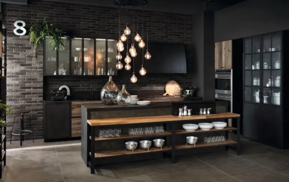 This image features an industrial style kitchen with exposed brick walls dark cabinetry and open shelving