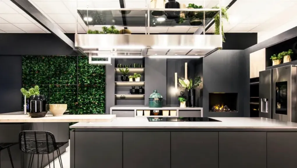 This image showcases a contemporary kitchen design with a strong focus on greenery and modern elements