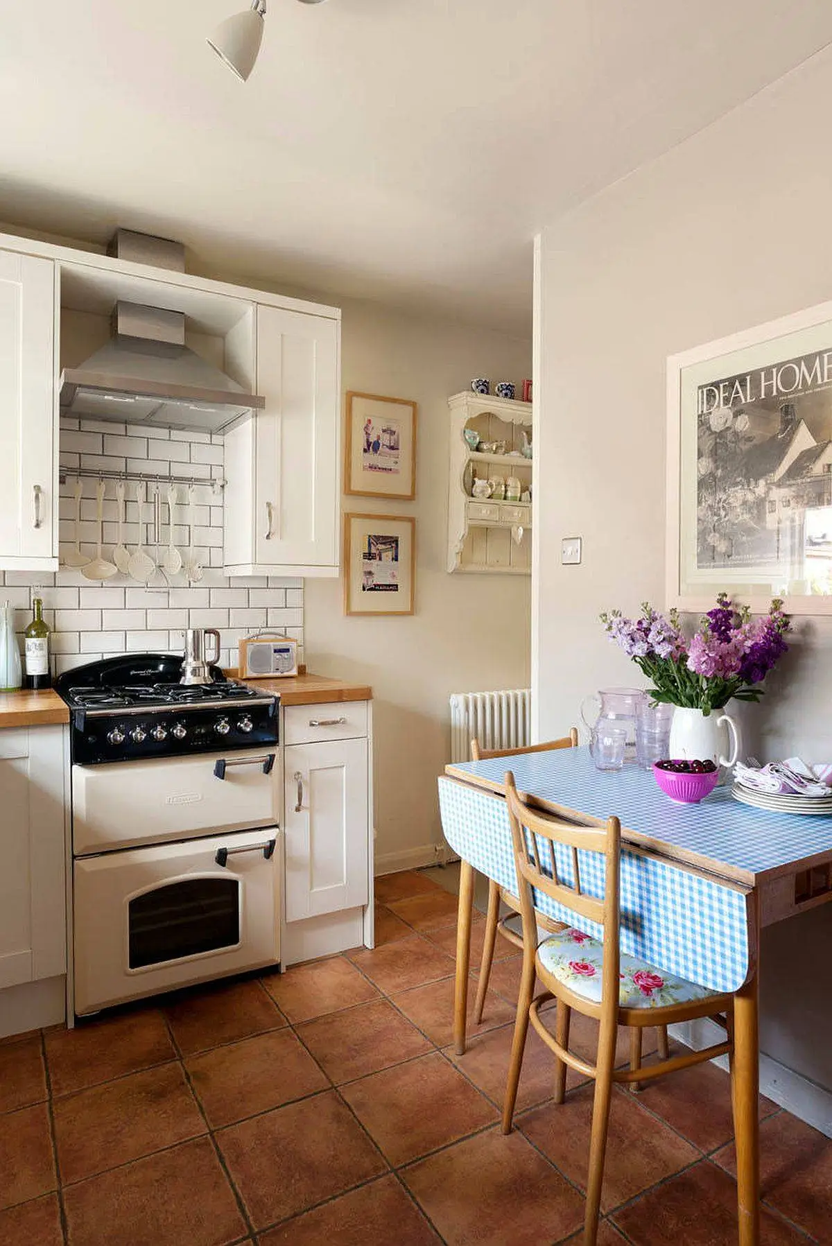Foldable dining table with checkered tablecloth in a cozy kitchen