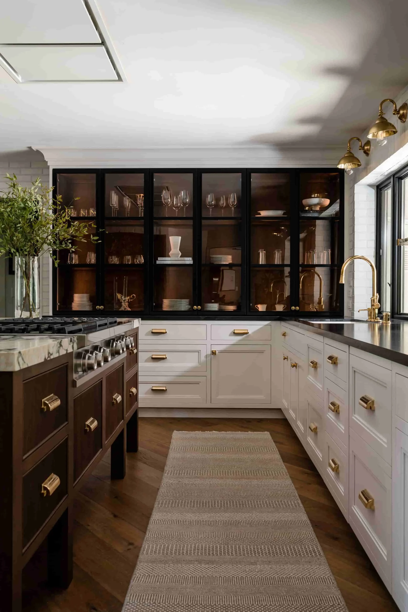Glass cabinet doors white cabinets and black countertops in kitchen Glass cabinet doors white cabinets and black countertops in kitchen