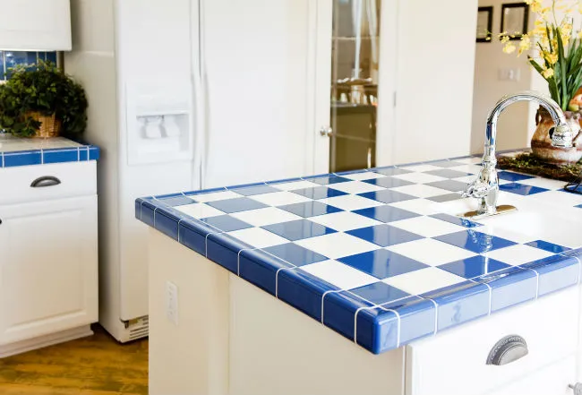 Kitchen island featuring blue and white checkered Ceramic Tile Countertops Kitchen island featuring blue and white checkered Ceramic Tile Countertops