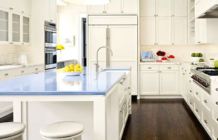 Light blue Lava Stone Countertop in a modern white kitchen offering a smooth glossy finish Light blue Lava Stone Countertop in a modern white kitchen offering a smooth glossy finish