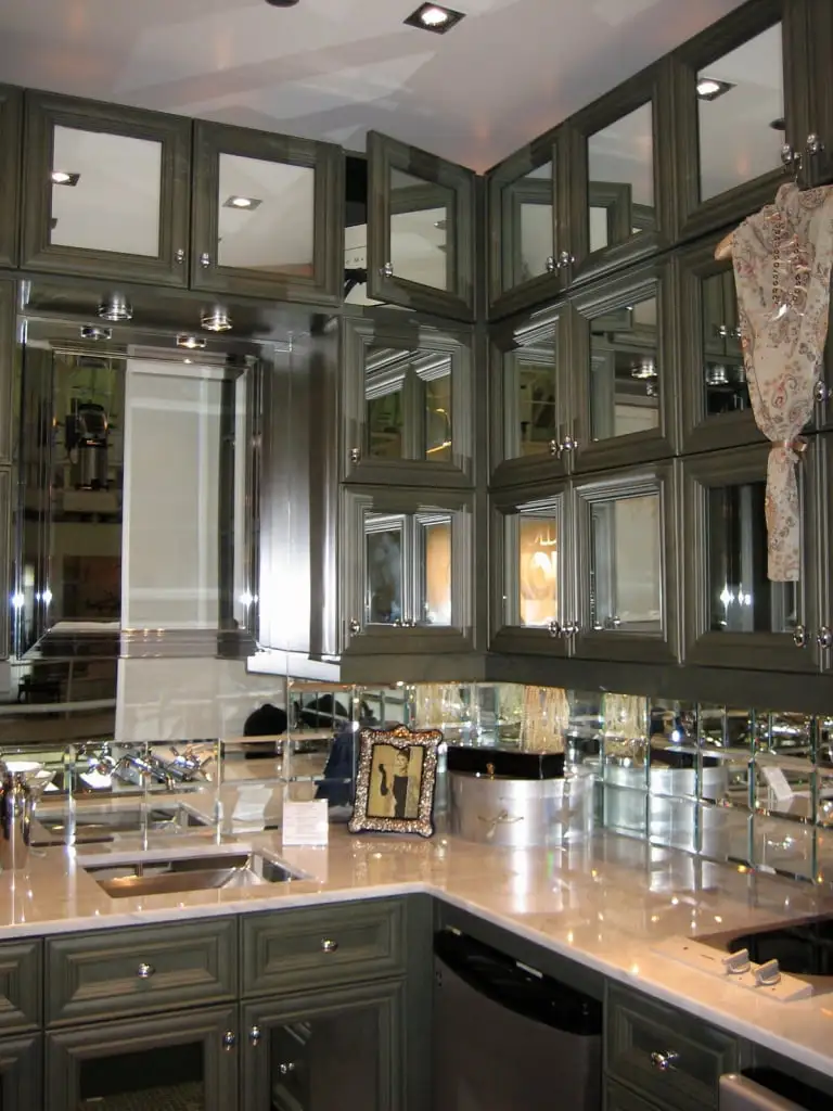 Mirrored cabinet doors in a small kitchen for added light and space