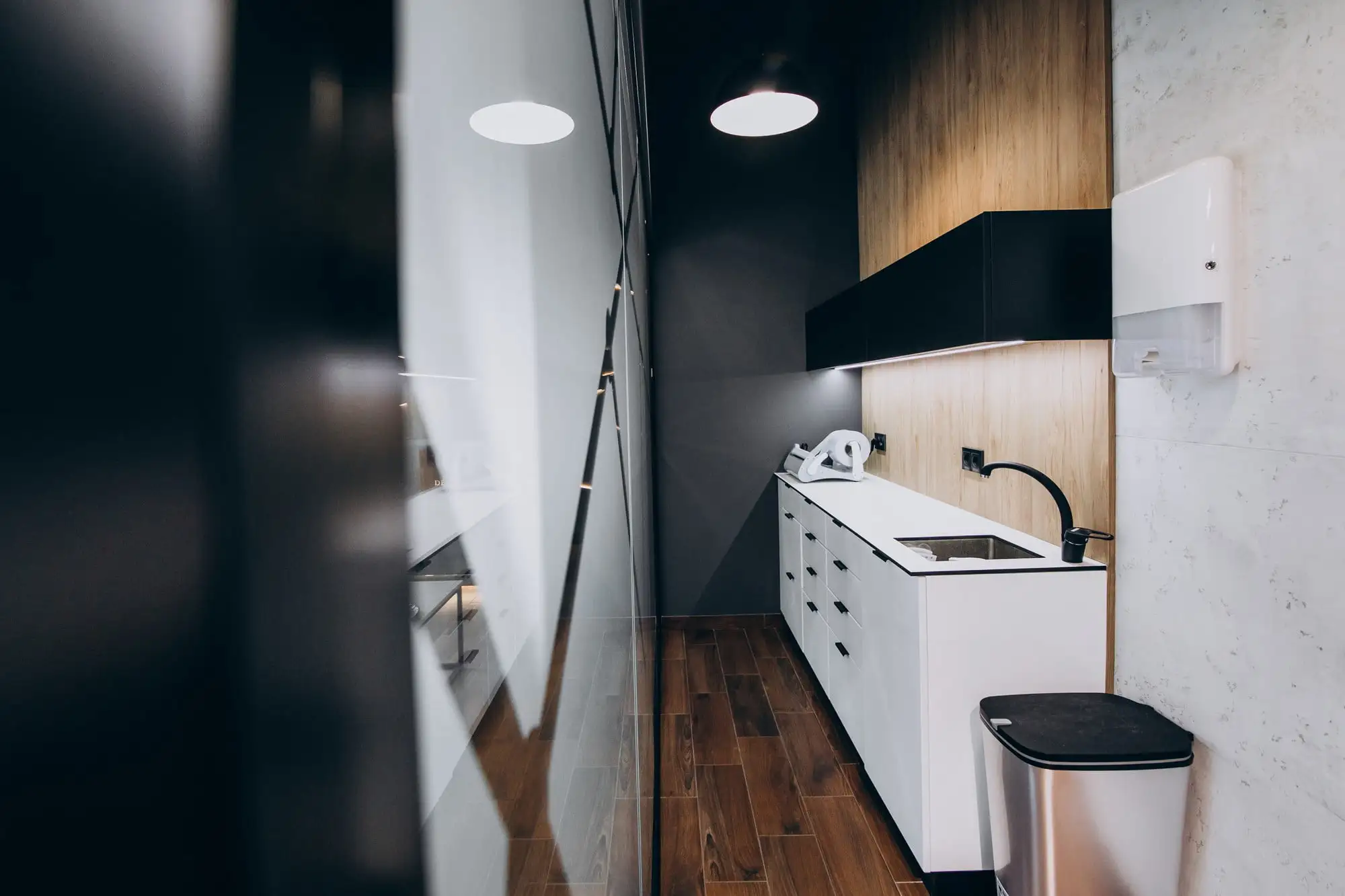 Modern small kitchen with sleek black and white design