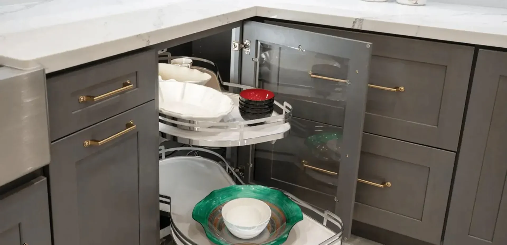 A lazy Susan kitchen cabinet with a glass front A lazy Susan kitchen cabinet with a glass front