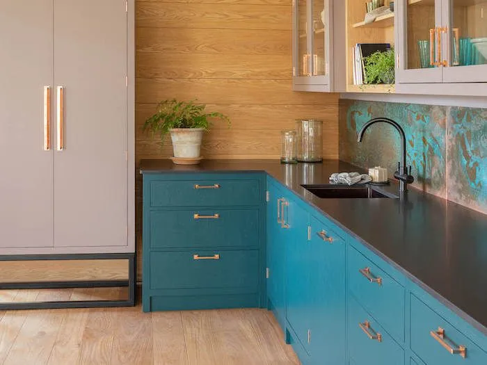Aqua Blue and Sandstone two tone kitchen cabinets with black countertop
