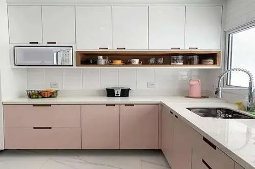 Blush pink base cabinets with light gray uppers