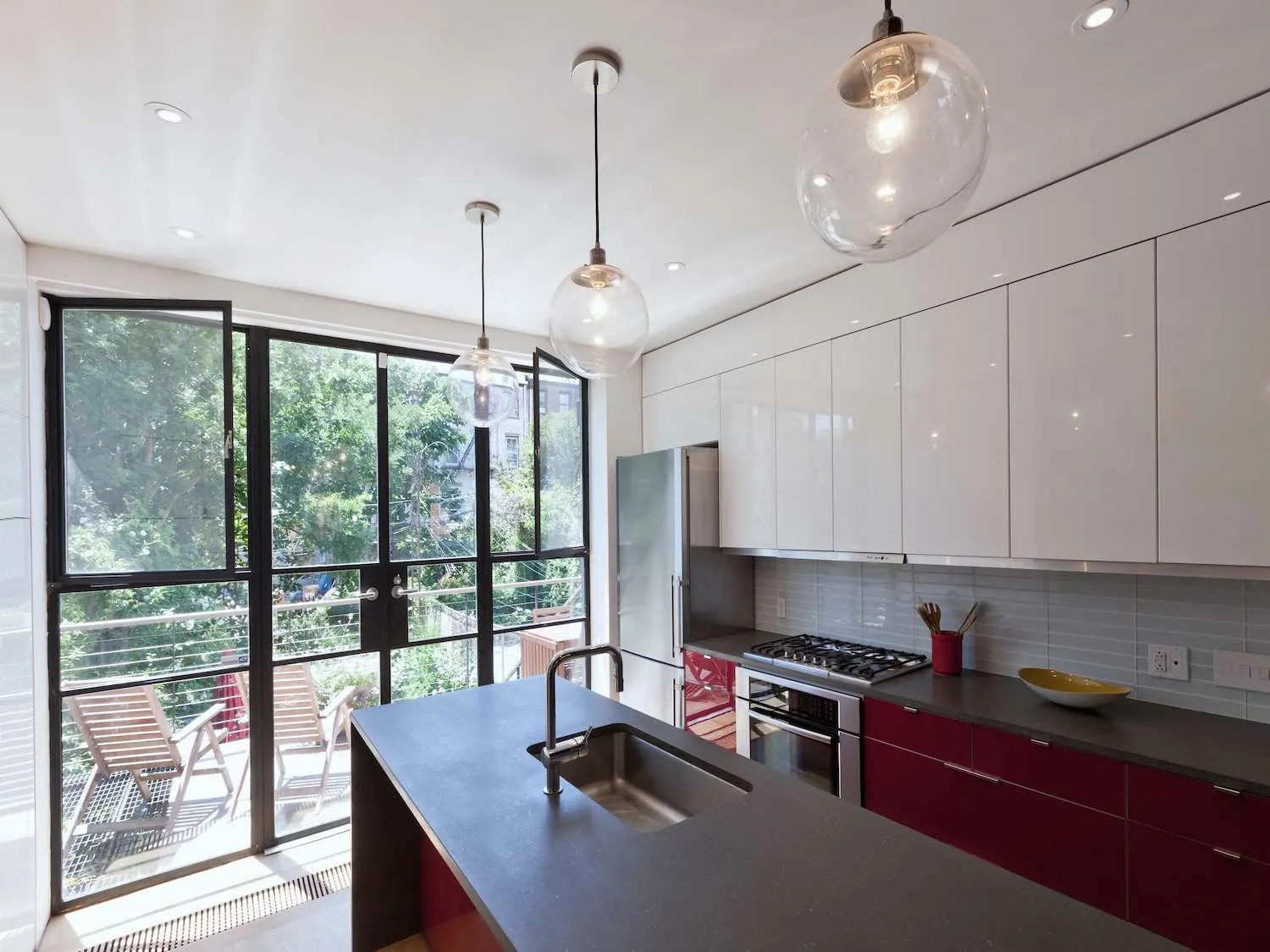Burgundy base cabinets paired with pearl gray uppers