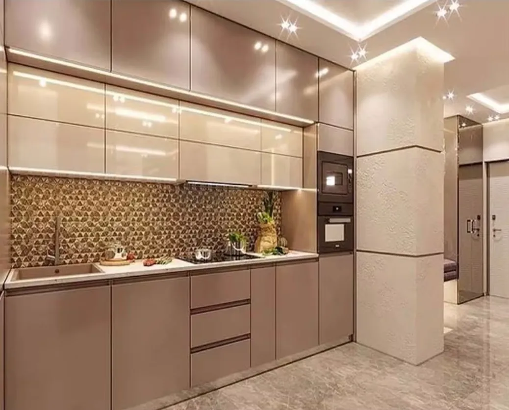 Champagne Gold Cabinets Kitchen with muted gold cabinets and geometric backsplash