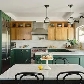 Jade green lowers with white oak uppers in a stylish kitchen