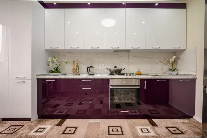 Mocha lower cabinets with soft white uppers in a sleek modern kitchen