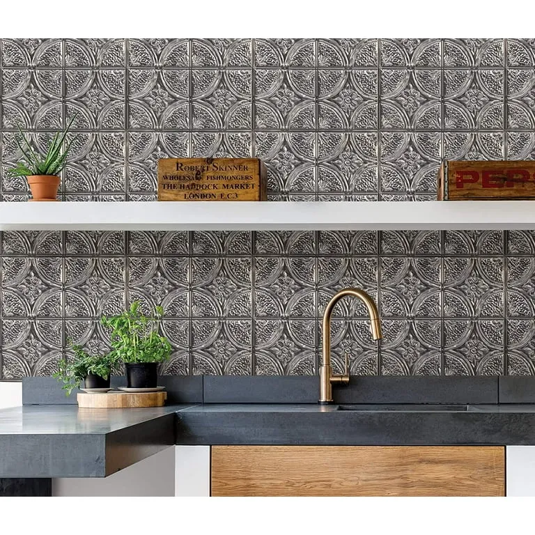 Modern kitchen backsplash with vintage tin tiles and brass faucet