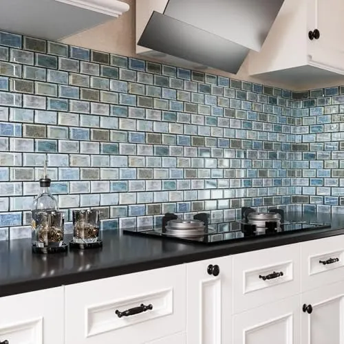Modern kitchen with 3D textured blue tile backsplash and white cabinets Modern kitchen with 3D textured blue tile backsplash and white cabinets