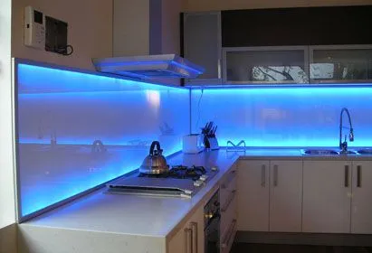 Modern kitchen with backlit glass backsplash and sleek design Modern kitchen with backlit glass backsplash and sleek design