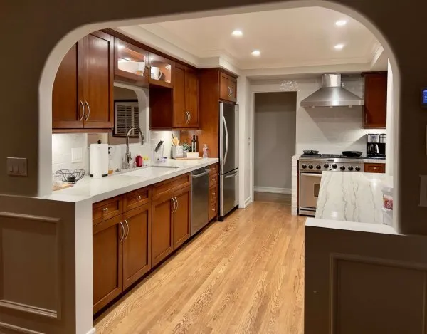 Modern kitchen with dark wooden cabinets and appliances