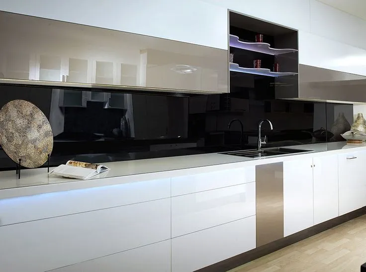 Modern kitchen with high gloss acrylic panel backsplash and sleek design Modern kitchen with high gloss acrylic panel backsplash and sleek design