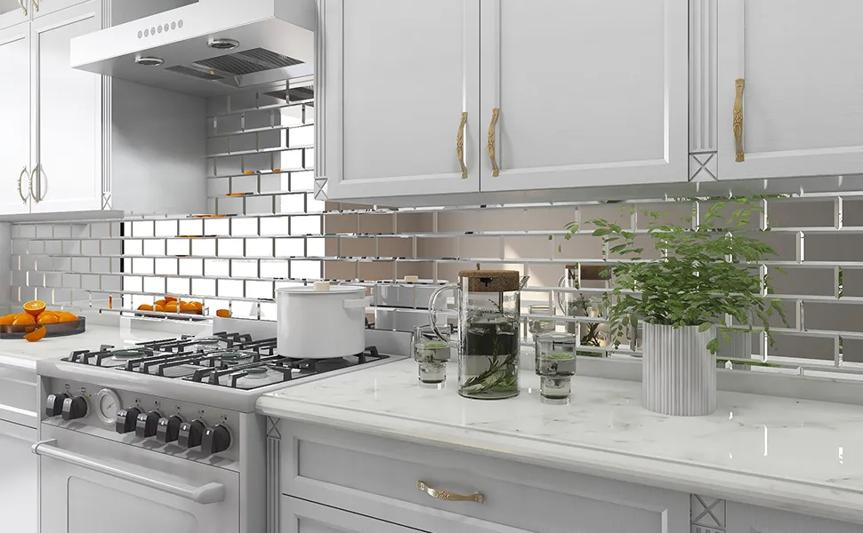 Modern kitchen with mirrored tile backsplash and white cabinetry Modern kitchen with mirrored tile backsplash and white cabinetry