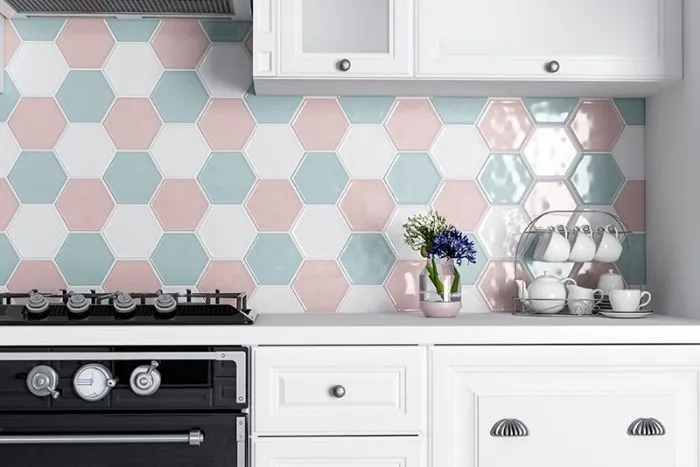 Modern kitchen with pastel hexagon tile backsplash and white cabinets Modern kitchen with pastel hexagon tile backsplash and white cabinets