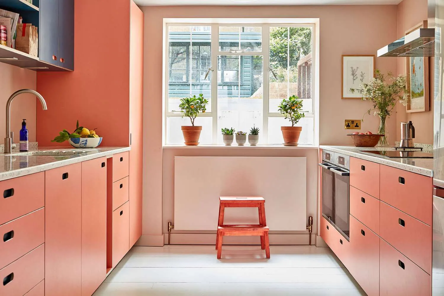 Peach CabinetsWarm kitchen with peach colored cabinets and large windows
