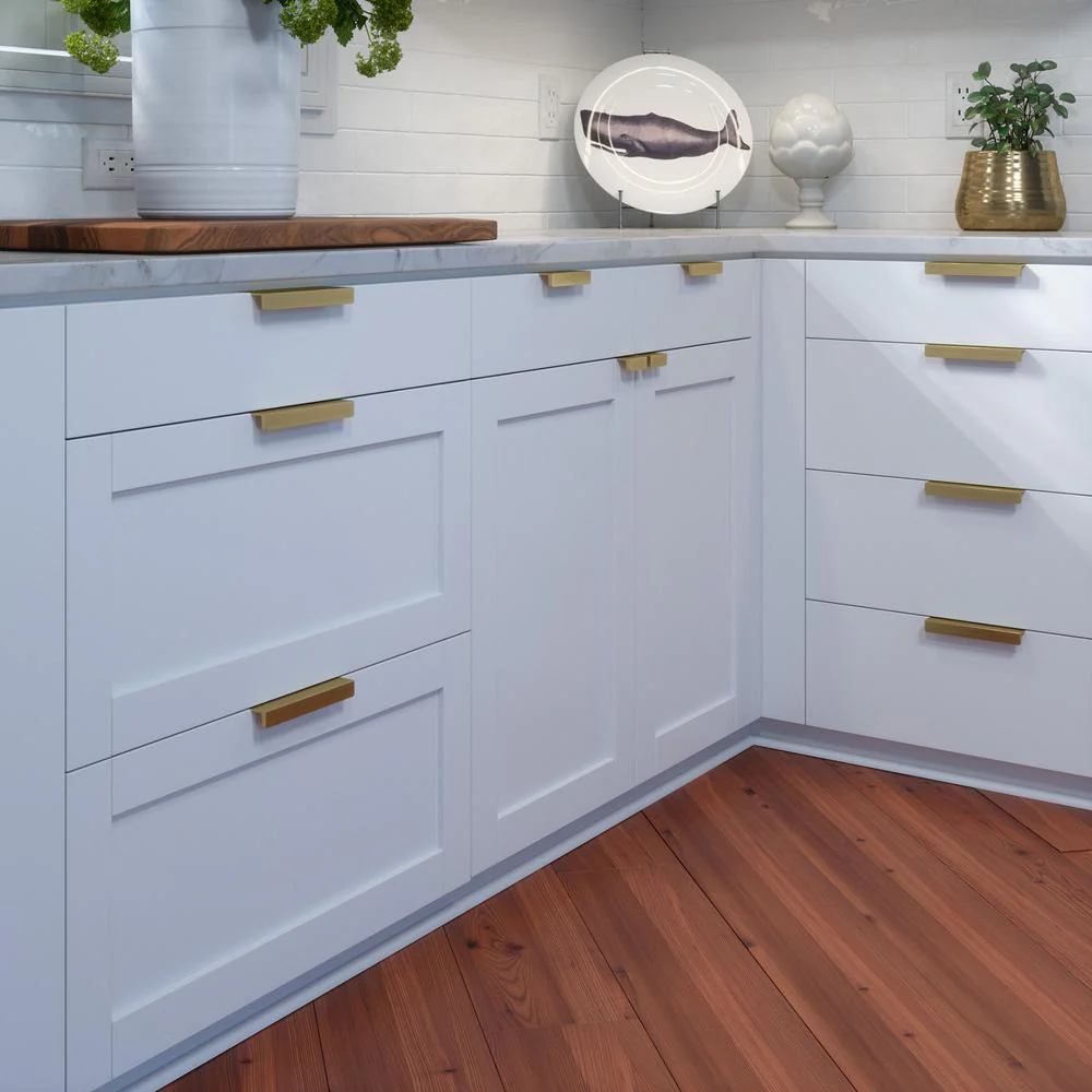 Polished brass kitchen cabinet handles arranged neatly Polished brass kitchen cabinet handles arranged neatly