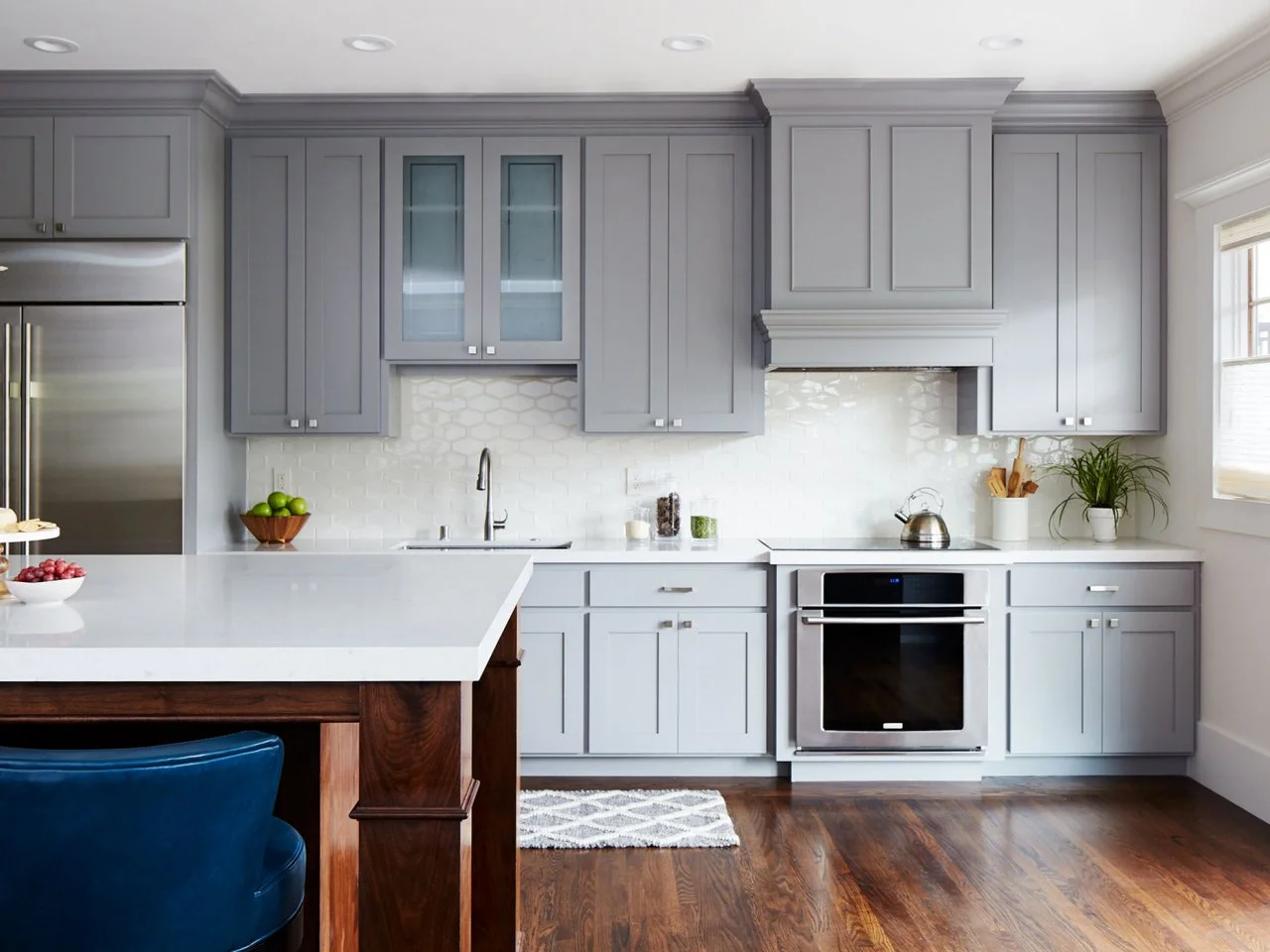 Stylish kitchen with blue cabinets and white accents