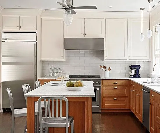Tangerine and Ash White two tone kitchen cabinets with marble island