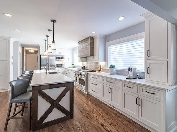 White farmhouse kitchen with rustic wooden island and chairs White farmhouse kitchen with rustic wooden island and chairs