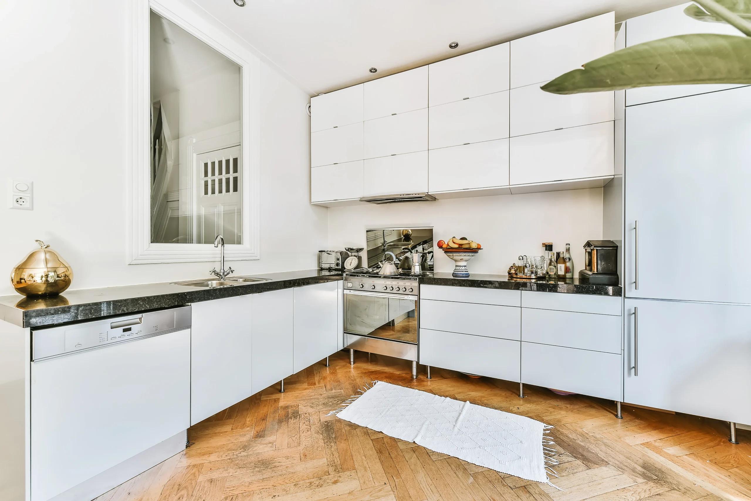 White modern kitchen with black countertops