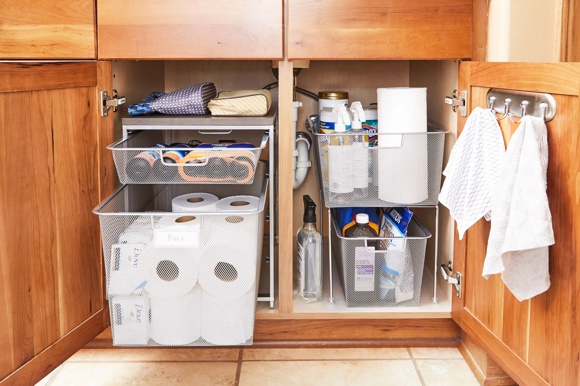 cleaning supplies with pull out bins and hooks