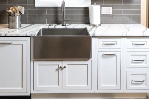 cutlery on the desk of white kitchen cabinet