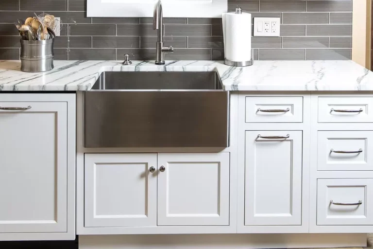 cutlery on the desk of white kitchen cabinet