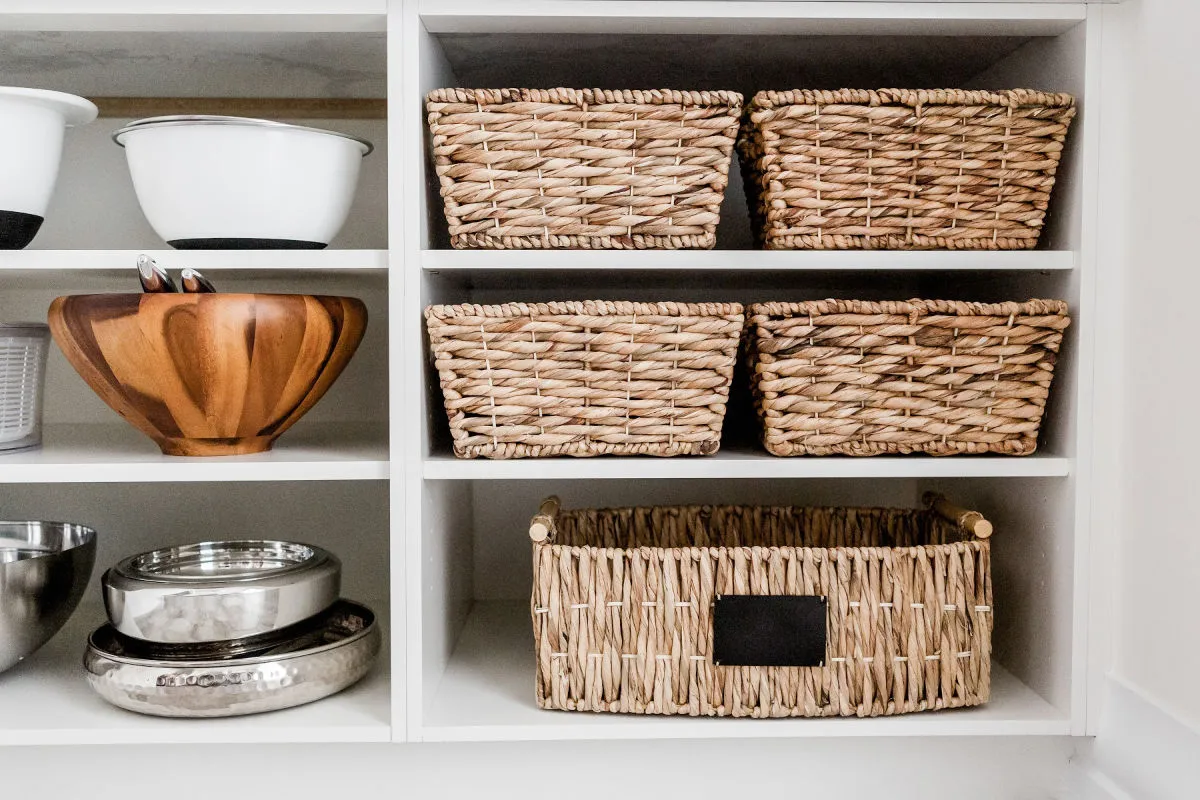 kitchen cabinet with baskets over cabinets