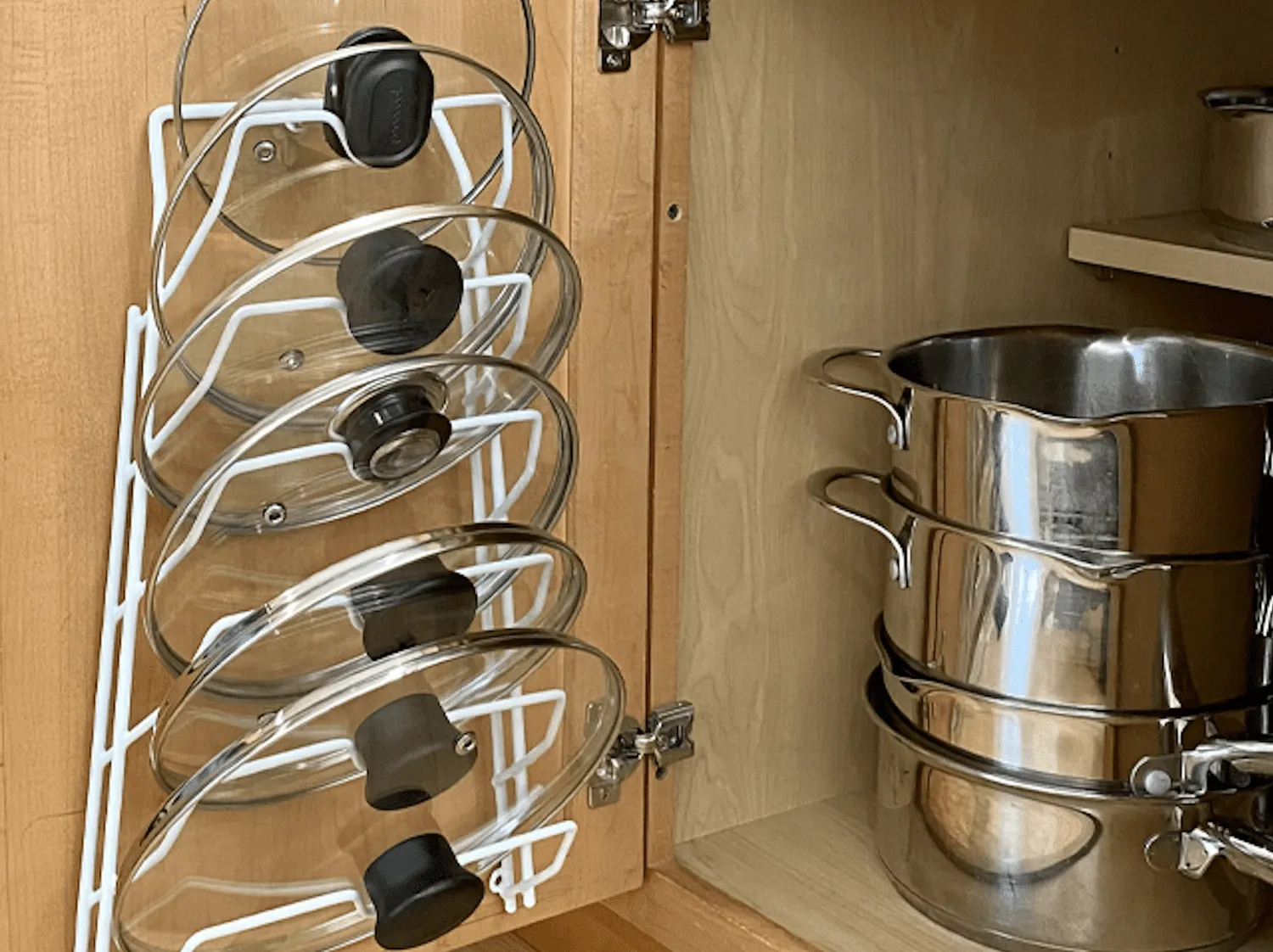 pot lid storage rack on the inside of cabinet doors