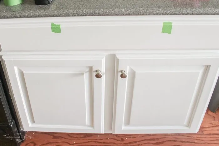white kitchen cabinet with brass knobs and marble countertop white kitchen cabinet with brass knobs and marble countertop