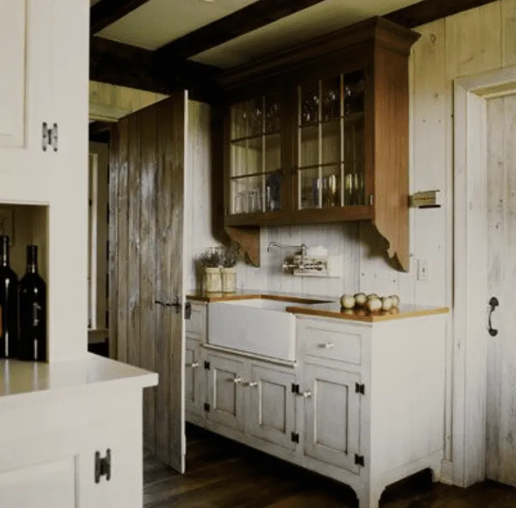 Antique style kitchen with weathered wood cabinets and glass doors Antique style kitchen with weathered wood cabinets and glass doors