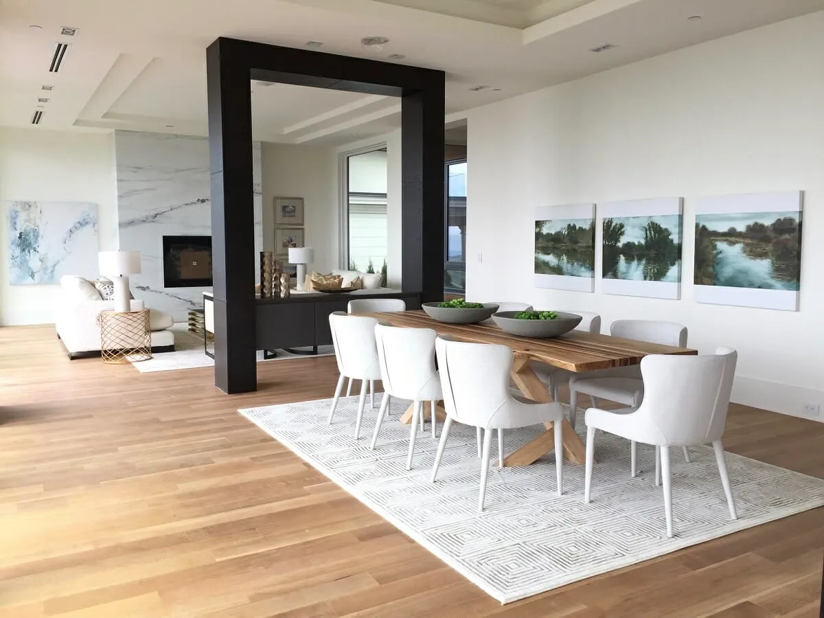 Bright airy living and dining room with a wood dining table Bright airy living and dining room with a wood dining table