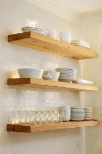 Open wooden shelves with built in lighting displaying dishes Open wooden shelves with built in lighting displaying dishes